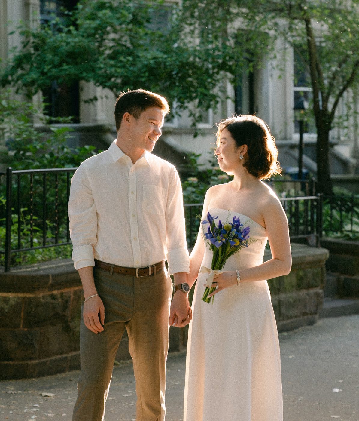 Alanna and Caleb smiling with flowers